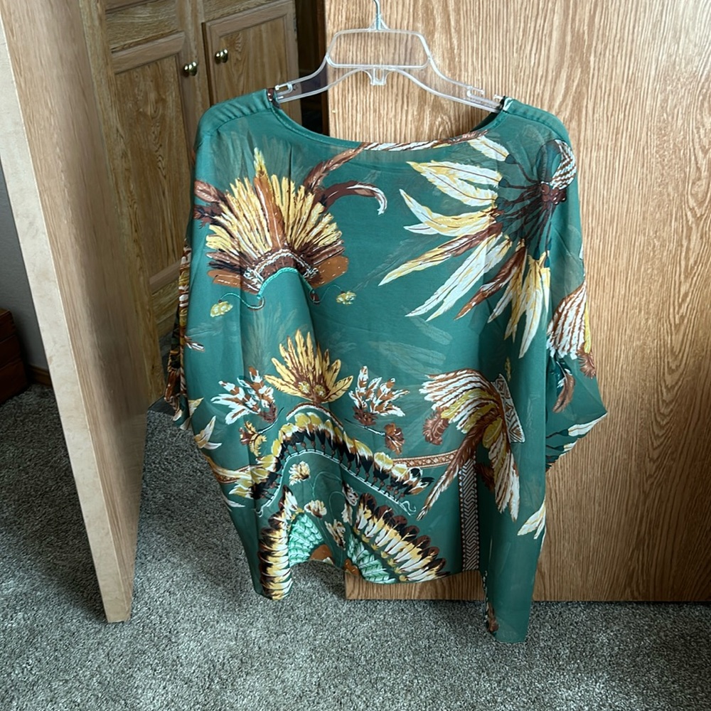 Sheer blouse.